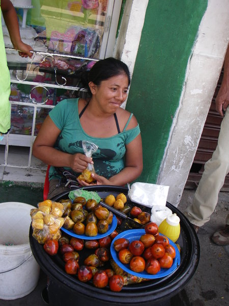Woman selling traditional fruits