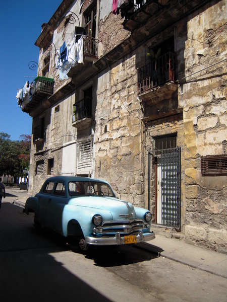 American 50's car and run down house in Havana