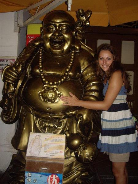 Rubbing the buddahs belly for good luck