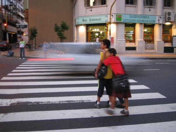 Boys crossing the road