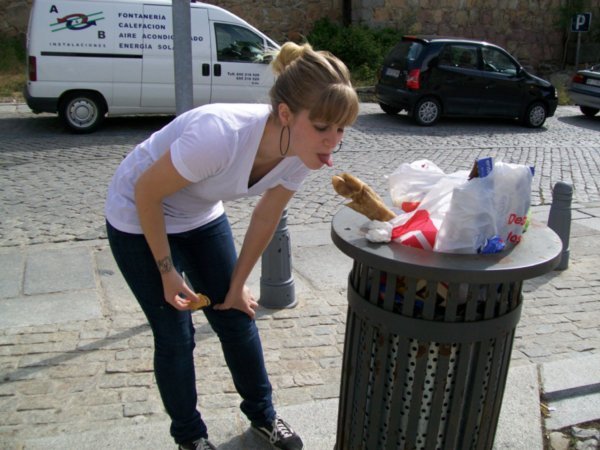 There was a pig foot in the garbage. Amanda pretended to lick it. 