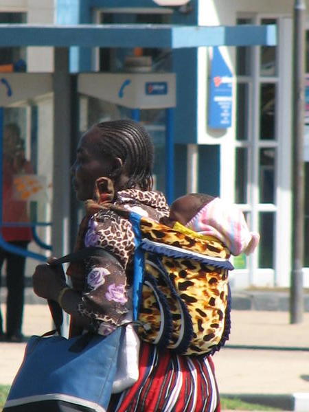 Namibian mom carrying child