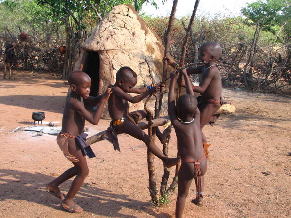 Himba boys playing see-saw 