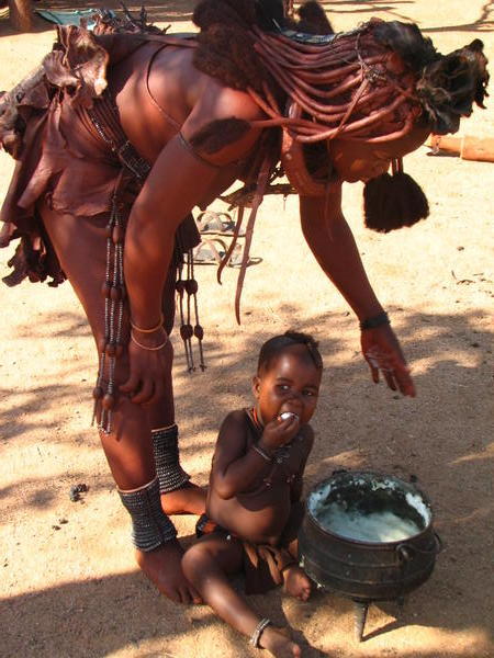 Boy eating maize meal