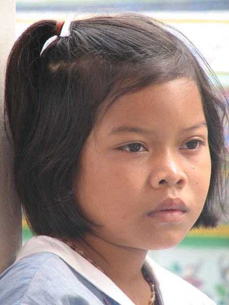 Pretty Thai girl with sad gaze