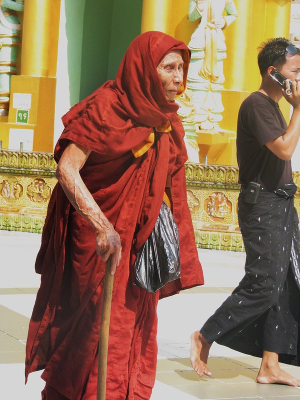 Monk & Burmese wearing longyis