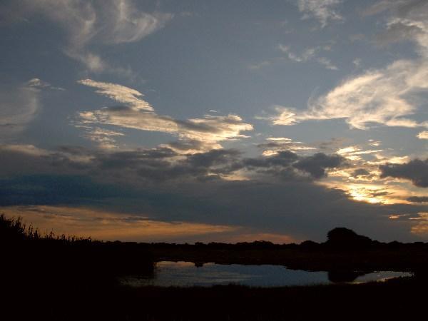 sunset over the waterhole at Namutoni