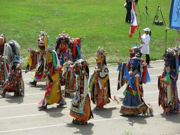 colourful figures at the opening ceremony for Naadam