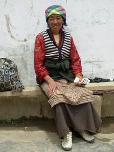 lady monitoring the toilets at Ganden Monastery