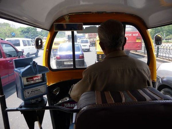 taking a tuktuk (autorickshaw) to the bus station, Bangalore