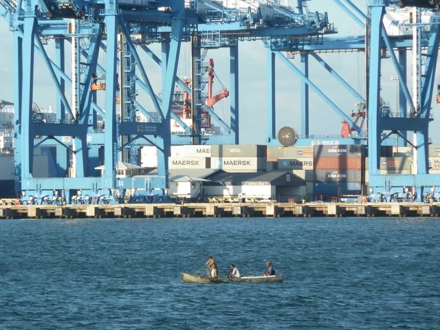 fishermen in front of Gatun container port