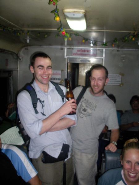 enjoying a beer on the train to chiang mai