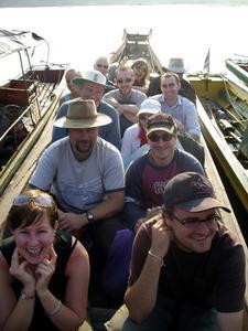 12 happy people in a boat 