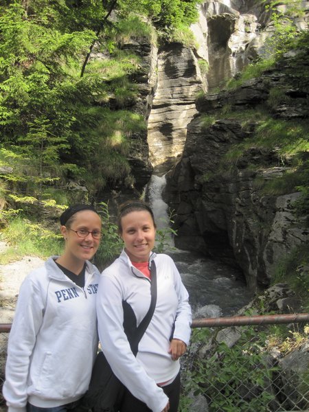 julie and lisa in front of a waterfall in the alps