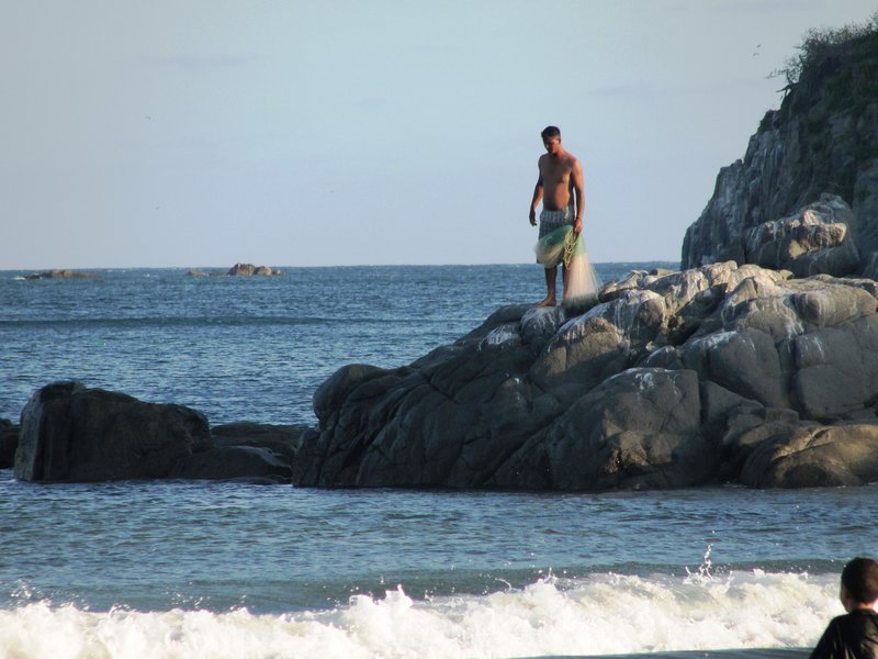 Fisherman on Rocks