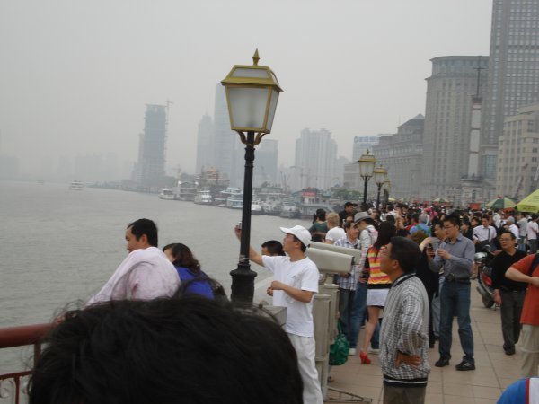 Tourists along the Huangpu River