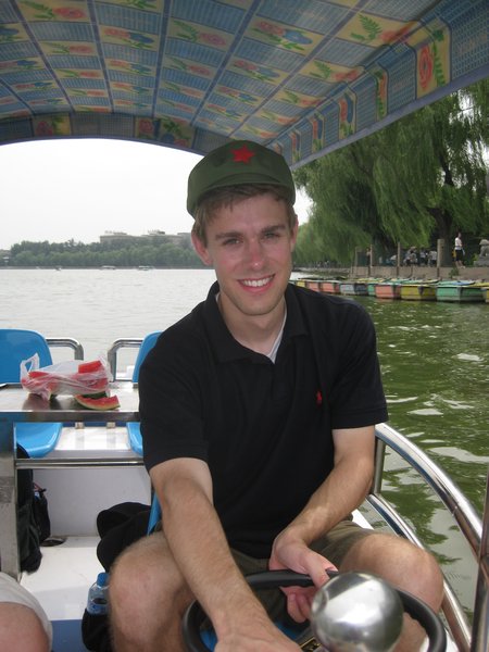 Matt Driving a Boat in Beihai Park