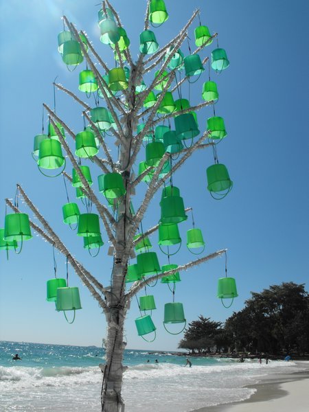 a christmas tree made from cocktail buckets