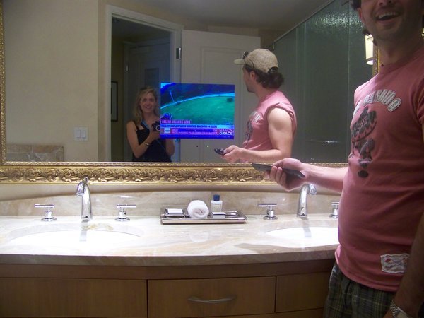 and a bathroom with a tv!