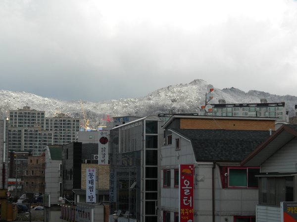 Snow on the san (mountains) surrounding Hopyeong