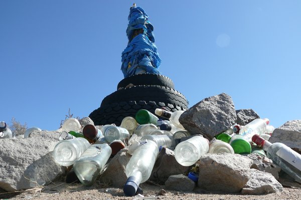 An ovoo (Mongolian: Ð¾Ð²Ð¾Ð¾, heap) is a type of shamanistic cairn found in Mongolia, usually made from rocks. Ovoos are often found at the top of mountains and in high places. They serve mainly as religious sites