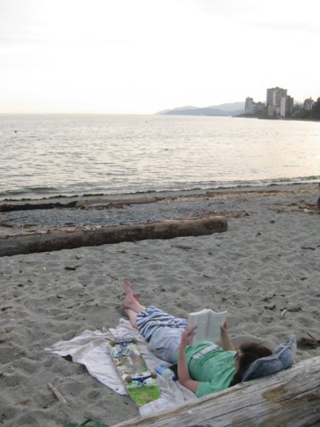 Lying on the beach reading