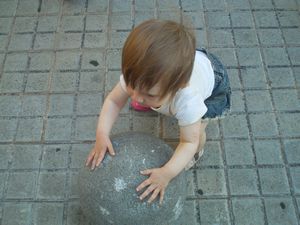 Delaney tries to lift a concrete 'ball'