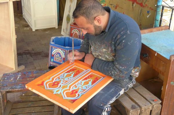 Craftsman painting furniture, Chefchaouen
