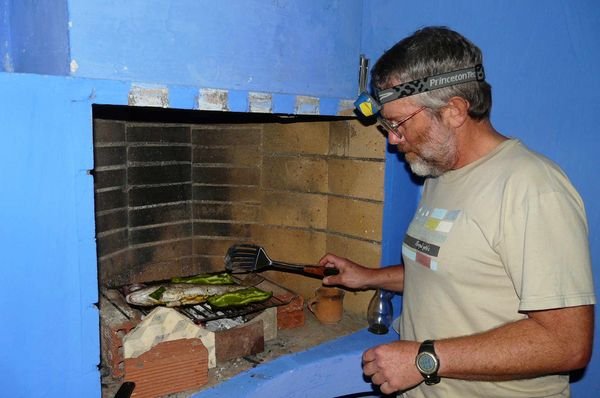Fish BBQ by headlamp on the roof at Asilah