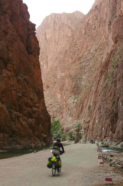 Kate cycling back down Todra Gorge