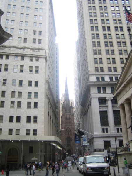 Looking down Wall Street at Trinity Church