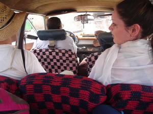 I'm sitting in the boot of this stationwagon taxi