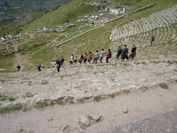 The group file down the steep descent in the Theatre of Pergamum