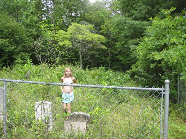 Standing in the overgrown abandoned graveyard