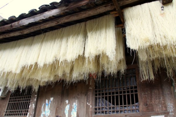 Fresh noodles drying in the sun