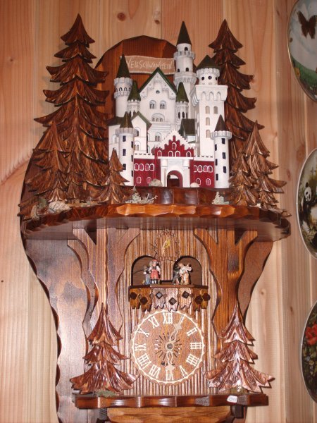 Handcarved neuschwanstein castle cuckoo clock in triberg