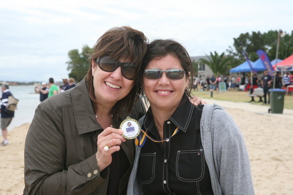 Tracy and Melissa with Jackson's medal