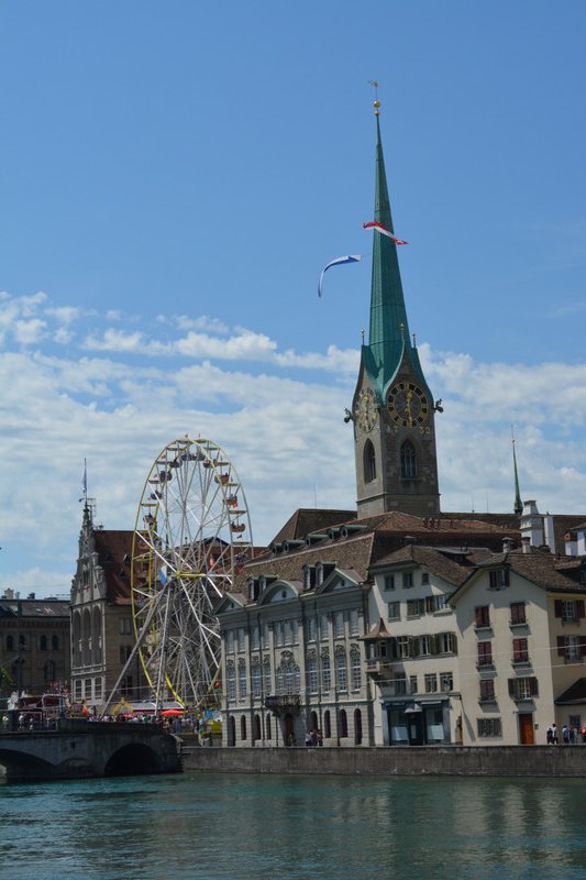 Ferris wheel in front of Fraumunster Church