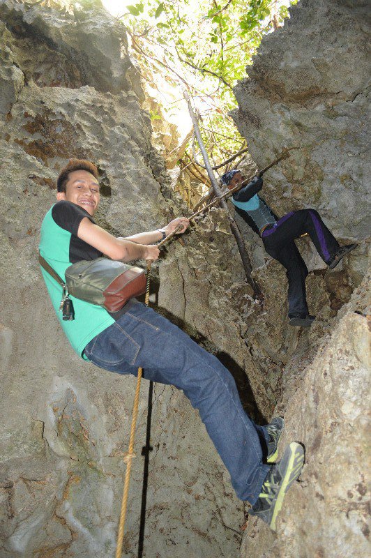 rappelling down the cave