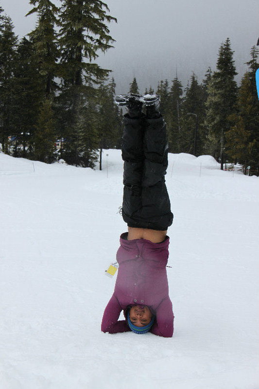 Head stand in the snow