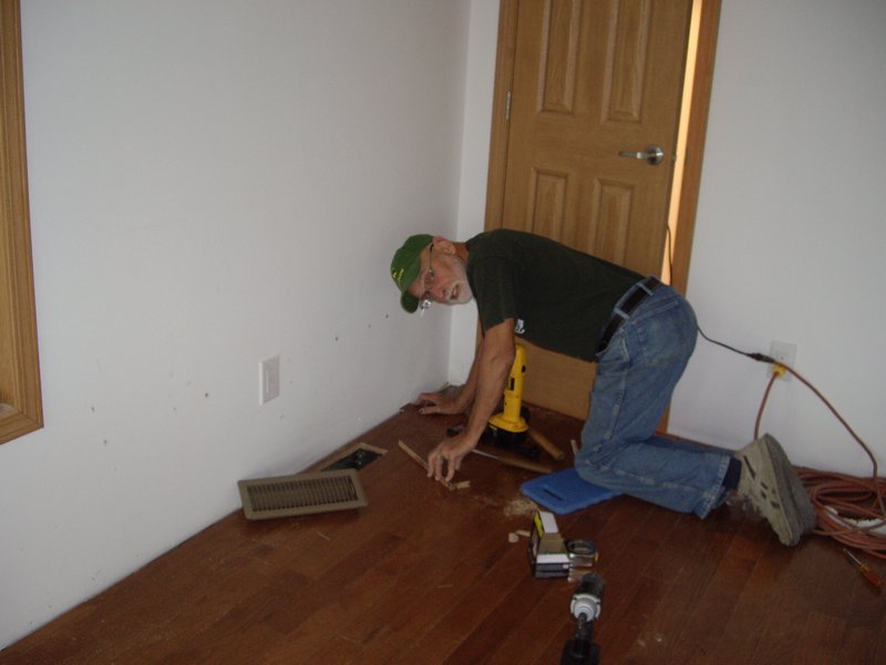 Bill installing hardwood floors