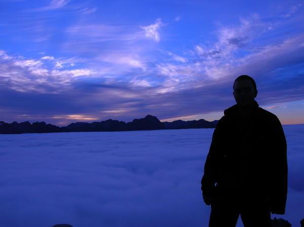 James's silhouette above the clouds