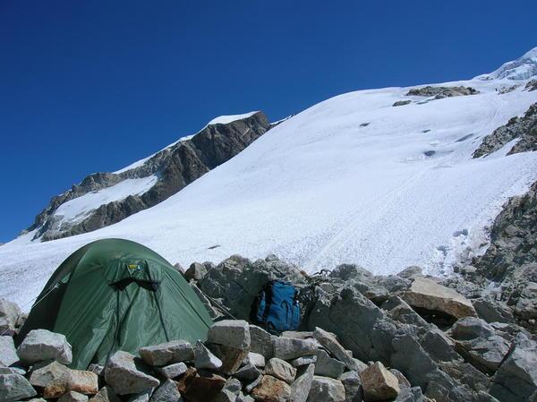 Poor tent pitched on rock
