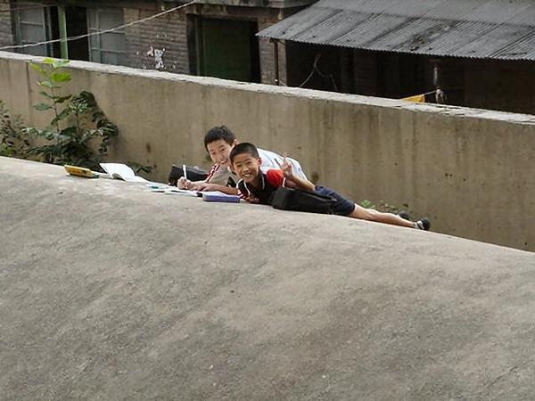 Two boys doing their homework