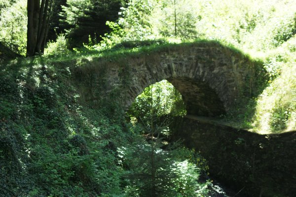 The stone walking bridge over the creek.