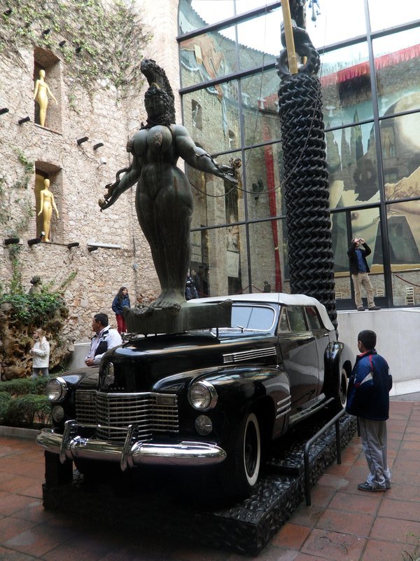 Dali's Cadillac and wild statue