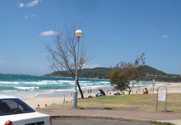 Byron Bay beach with the lighthouse in the distance