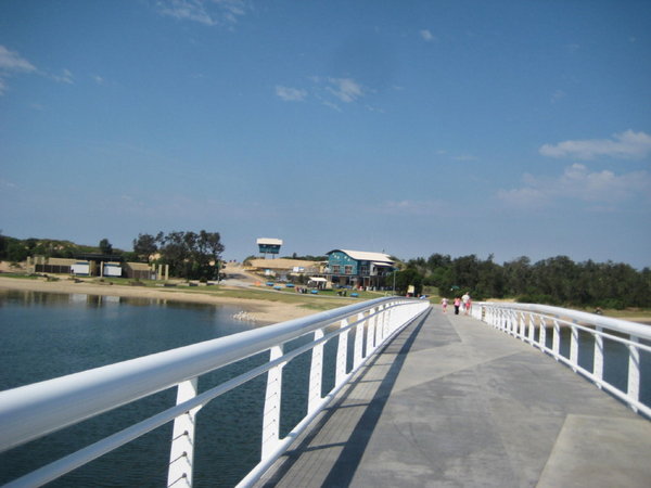 The footbridge over the lake to the beach