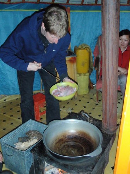 Graham cooking fish in our 1st Ger