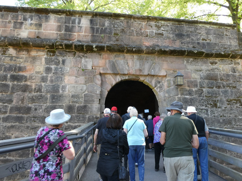 Entrance across the moat bridge through one castle wall
